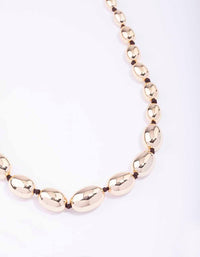 Gold Oval Bead Graduating Cord Necklace - link has visual effect only